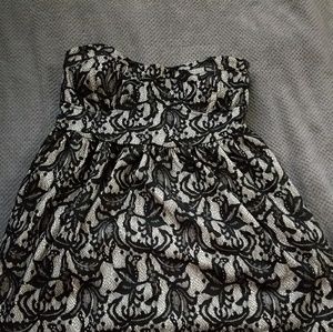 Black lace strapless dress.